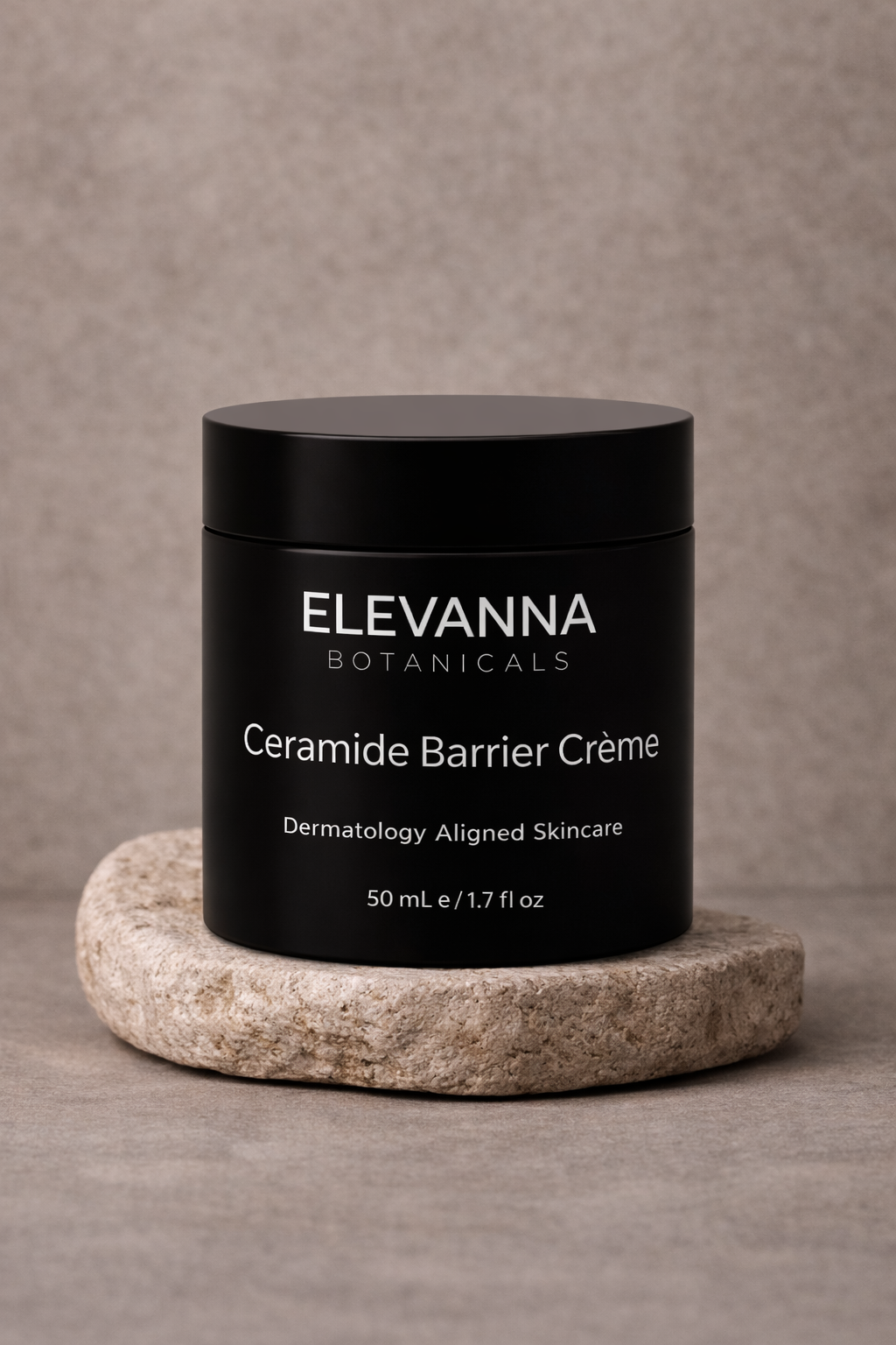 Elevanna Botanicals Ceramide Barrier Creme jar on a stone surface with a neutral background